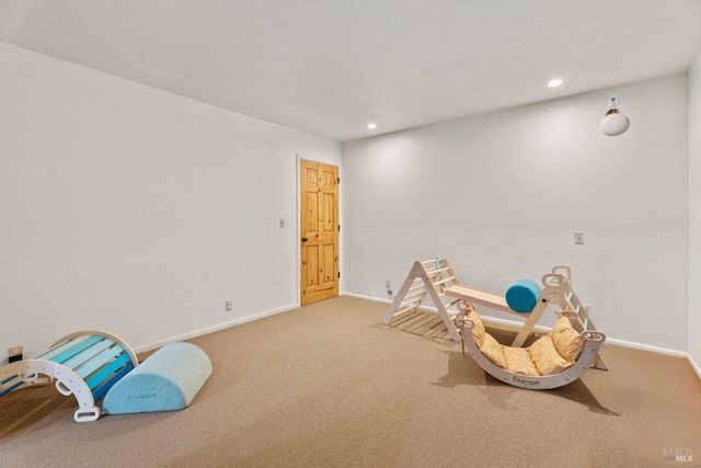 recreation room featuring carpet flooring, baseboards, and recessed lighting