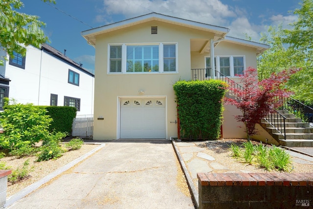 504 C St, San Rafael, CA 94901 - view of front of home featuring an attached garage, concrete driveway, stucco siding, and stairs