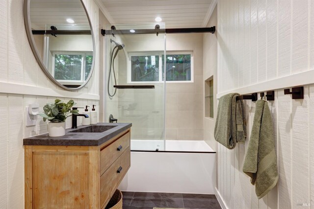 full bath with bath / shower combo with glass door, vanity, and recessed lighting