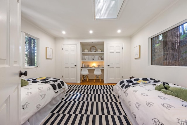 bedroom featuring ornamental molding, recessed lighting, and wood finished floors