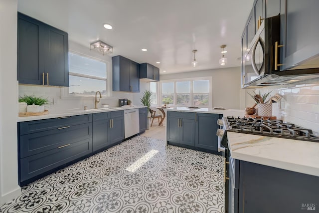948 Benicia Rd, Vallejo, CA 94591 - kitchen featuring stainless steel appliances, a peninsula, decorative backsplash, recessed lighting, and a sink