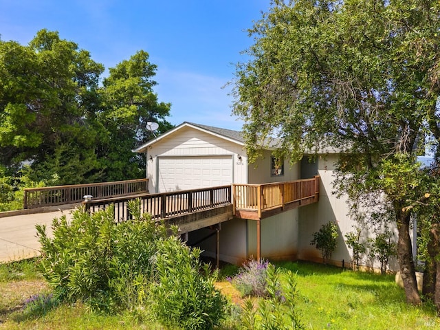 rear view of property featuring a wooden deck