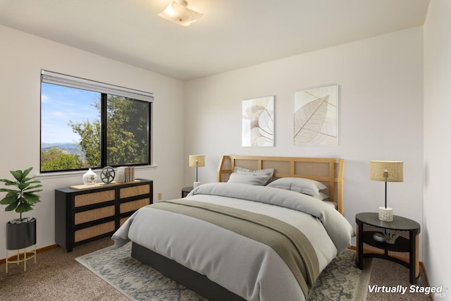 carpeted bedroom with baseboards