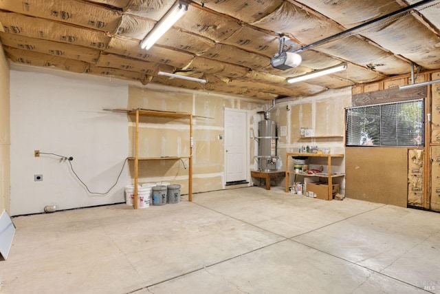 below grade area with water heater and a garage