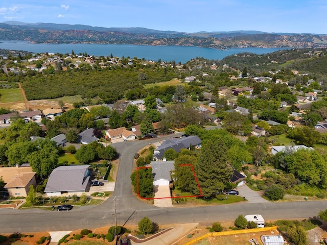 birds eye view of property with a water and mountain view and a residential view