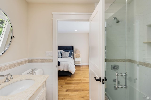 1450 Diamond Mountain Rd, Calistoga, CA 94515 - ensuite bathroom featuring a shower stall, tile walls, ensuite bath, and wood finished floors