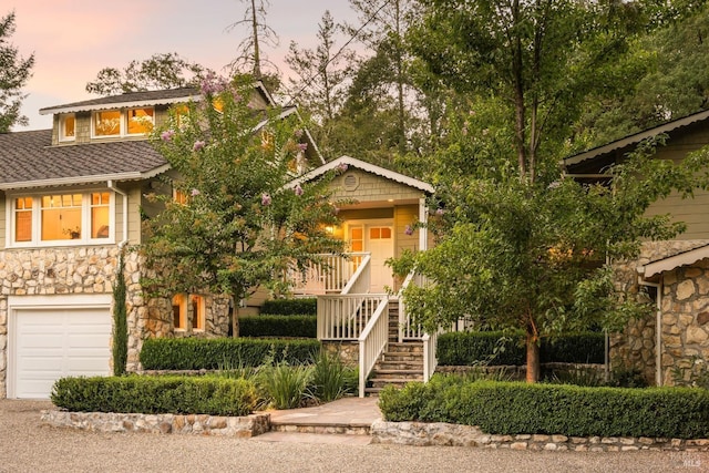 1450 Diamond Mountain Rd, Calistoga, CA 94515 - view of front of property with stairs, stone siding, covered porch, and a garage