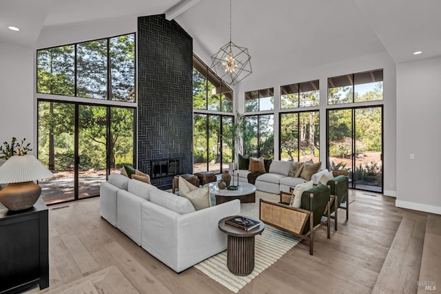 40 Los Pinos, Nicasio, CA 94946 - living area featuring a fireplace, light wood finished floors, high vaulted ceiling, and plenty of natural light