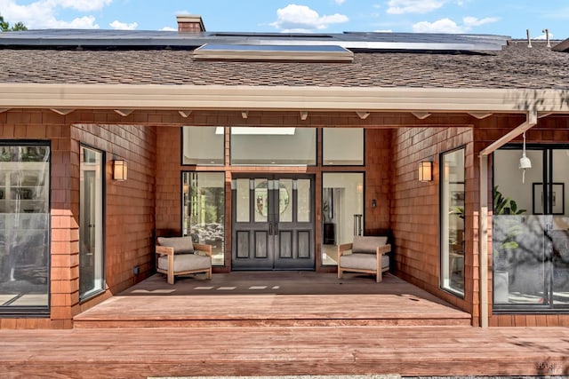 40 Los Pinos, Nicasio, CA 94946 - doorway to property featuring a deck, a shingled roof, and solar panels