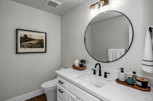 40 Los Pinos, Nicasio, CA 94946 - bathroom featuring toilet, baseboards, visible vents, vanity, and wood finished floors