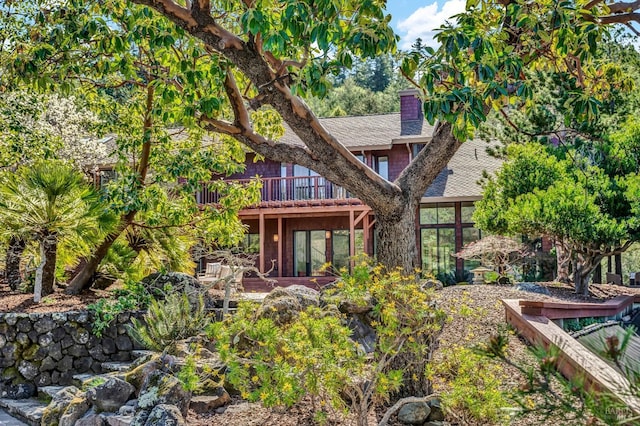 40 Los Pinos, Nicasio, CA 94946 - rear view of house featuring roof with shingles, a chimney, and a wooden deck
