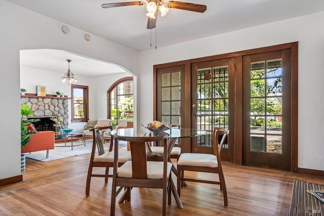 1531 F St, Napa, CA 94559 - dining area featuring arched walkways, a healthy amount of sunlight, a ceiling fan, and wood finished floors