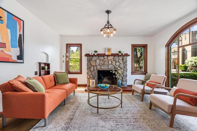 1531 F St, Napa, CA 94559 - living area with an inviting chandelier, a wealth of natural light, wood finished floors, and a fireplace