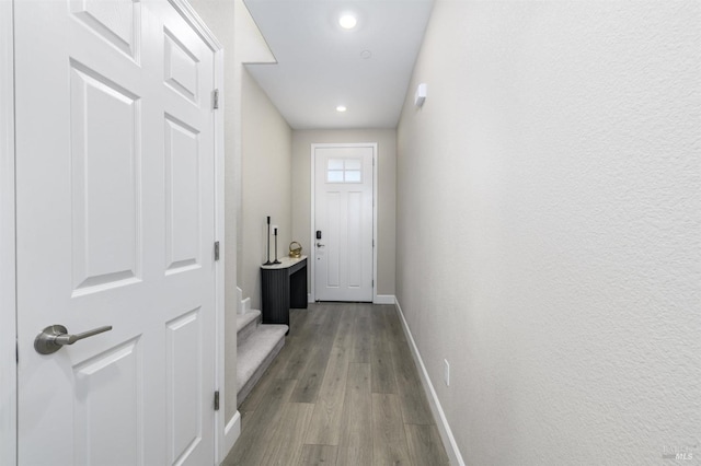 doorway to outside with stairway, recessed lighting, baseboards, and wood finished floors