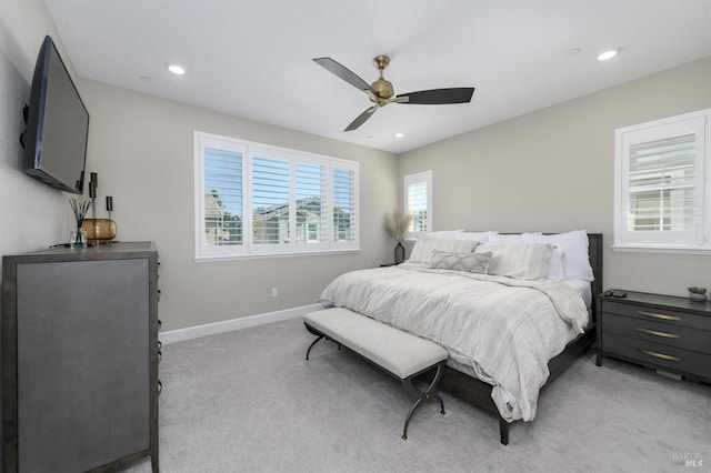 bedroom with light colored carpet, baseboards, a ceiling fan, and recessed lighting