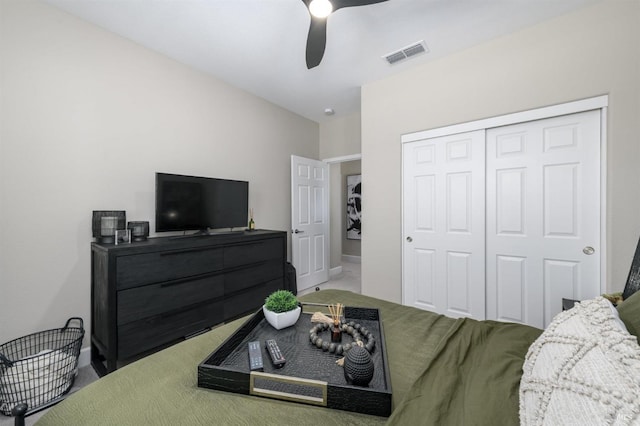 bedroom with a closet, visible vents, carpet floors, a ceiling fan, and baseboards