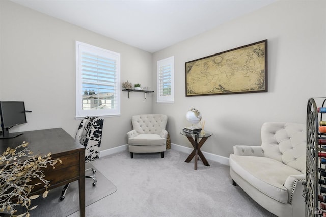 carpeted office space featuring baseboards