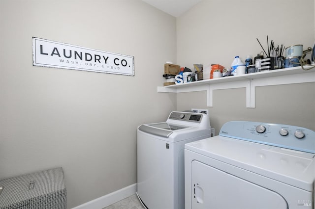 laundry room featuring washer and dryer, laundry area, and baseboards