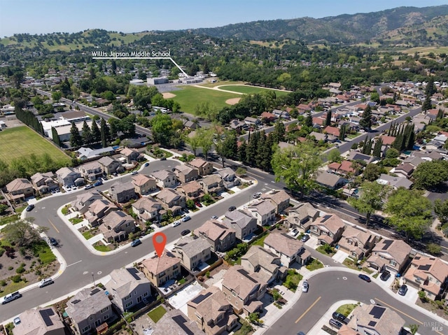 birds eye view of property with a mountain view and a residential view