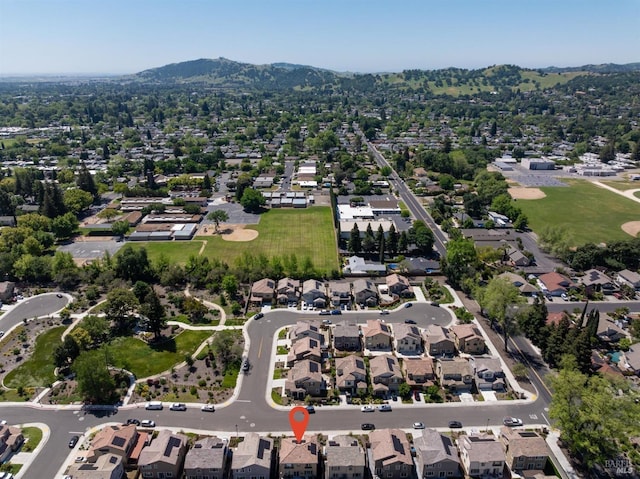 birds eye view of property with a mountain view and a residential view