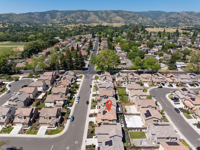 birds eye view of property with a mountain view and a residential view