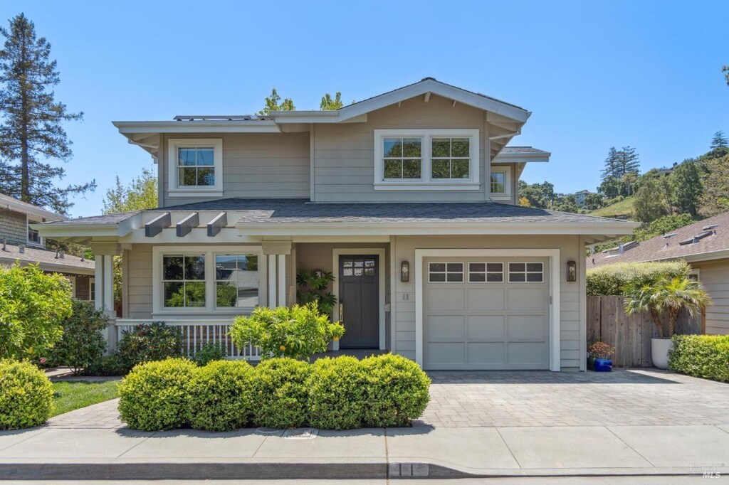 11 Heather Way, Larkspur, CA 94939 - view of front of house with decorative driveway, an attached garage, and roof with shingles