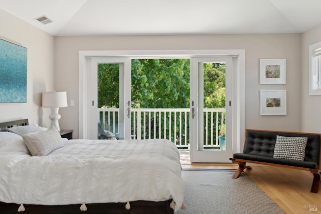 11 Heather Way, Larkspur, CA 94939 - bedroom with multiple windows, access to exterior, wood finished floors, and lofted ceiling