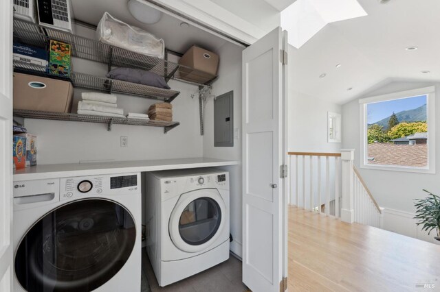 11 Heather Way, Larkspur, CA 94939 - laundry room with independent washer and dryer, electric panel, a skylight, recessed lighting, and tile patterned flooring