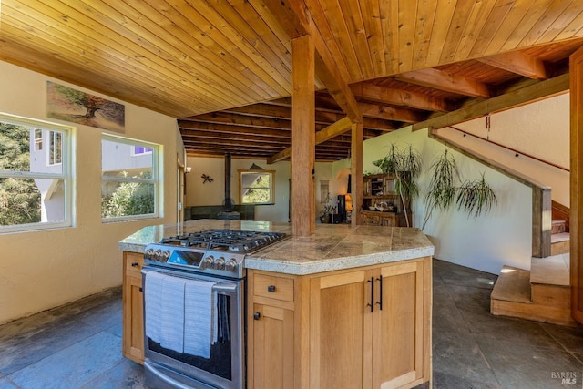 32211 Condor Rd, Willits, CA 95490 - kitchen featuring beam ceiling, a wood stove, wooden ceiling, gas range, and tile counters