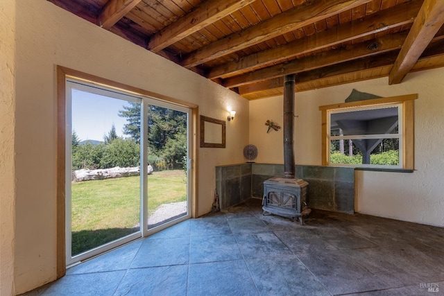 32211 Condor Rd, Willits, CA 95490 - interior space featuring a wealth of natural light, a wood stove, and beam ceiling