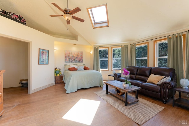 32211 Condor Rd, Willits, CA 95490 - bedroom featuring baseboards, light wood-type flooring, and vaulted ceiling with skylight