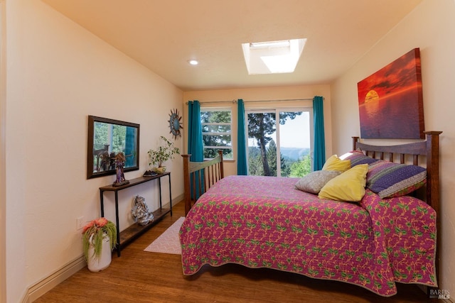 32211 Condor Rd, Willits, CA 95490 - bedroom featuring a skylight, baseboards, recessed lighting, and wood finished floors