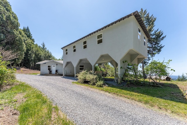 32211 Condor Rd, Willits, CA 95490 - view of front of property with stucco siding and gravel driveway