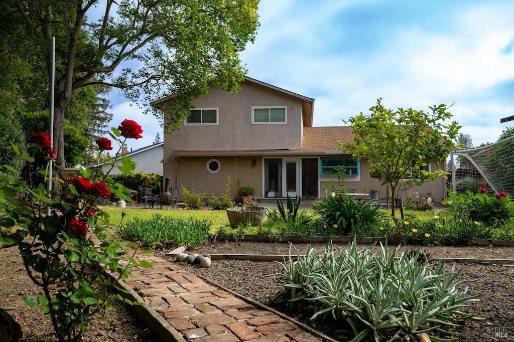 back of property with stucco siding