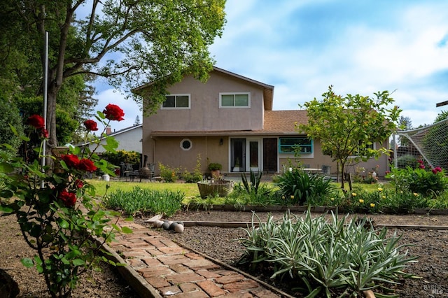back of property with stucco siding