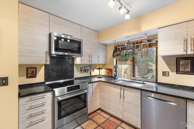 822 2nd St W, Sonoma, CA 95476 - kitchen featuring light brown cabinets, light tile patterned floors, a sink, track lighting, and appliances with stainless steel finishes