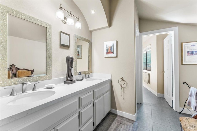 822 2nd St W, Sonoma, CA 95476 - bathroom featuring double vanity, a sink, and vaulted ceiling