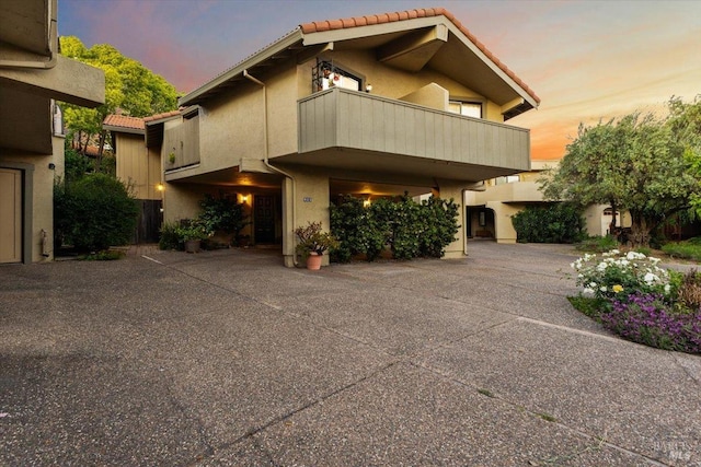 822 2nd St W, Sonoma, CA 95476 - view of front of home featuring a tile roof, stucco siding, and a balcony