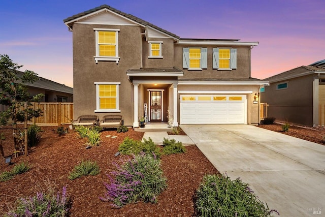 1532 Base Ct, Dixon, CA 95620 - traditional-style house with concrete driveway, stucco siding, fence, and a garage