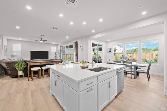 1532 Base Ct, Dixon, CA 95620 - kitchen featuring stainless steel dishwasher, open floor plan, visible vents, and a sink