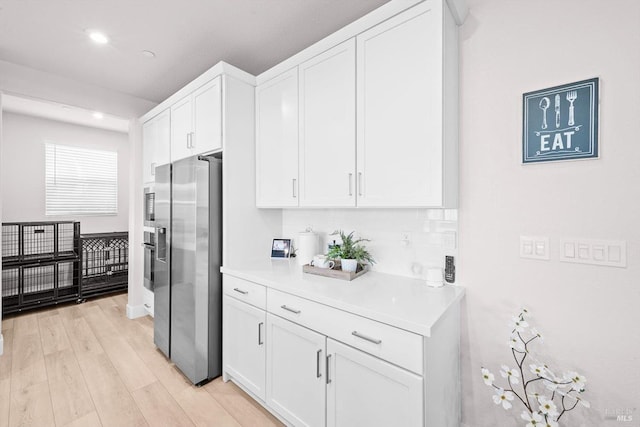 1532 Base Ct, Dixon, CA 95620 - kitchen featuring light wood-style flooring, recessed lighting, white cabinetry, light countertops, and appliances with stainless steel finishes