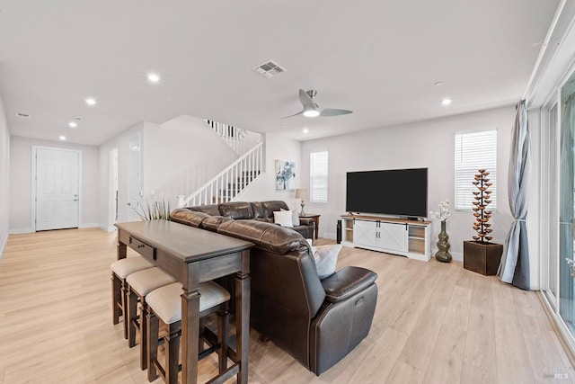 1532 Base Ct, Dixon, CA 95620 - living area featuring light wood-style flooring, recessed lighting, baseboards, visible vents, and stairs