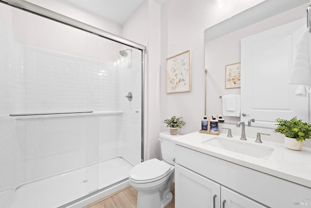 1532 Base Ct, Dixon, CA 95620 - bathroom with a stall shower, vanity, toilet, and wood finished floors