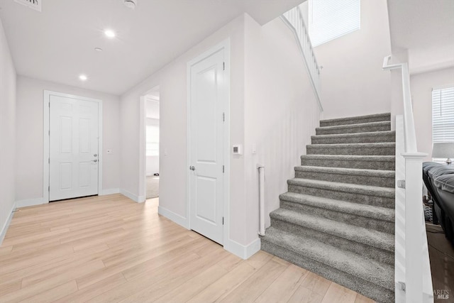 1532 Base Ct, Dixon, CA 95620 - entrance foyer with baseboards, stairs, light wood finished floors, and recessed lighting
