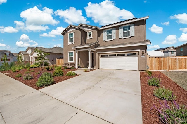 1532 Base Ct, Dixon, CA 95620 - view of front of home featuring an attached garage, a residential view, stucco siding, fence, and concrete driveway