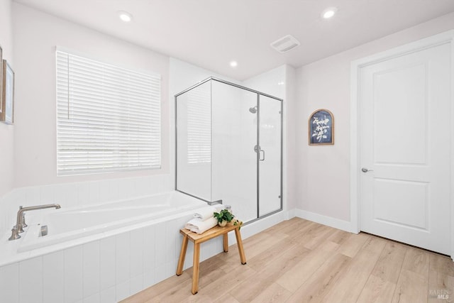 1532 Base Ct, Dixon, CA 95620 - bathroom featuring wood finished floors, visible vents, recessed lighting, a stall shower, and a bath