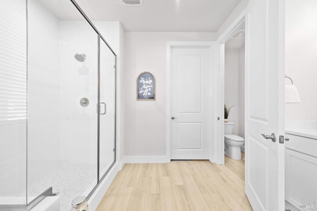 1532 Base Ct, Dixon, CA 95620 - full bathroom featuring vanity, toilet, wood finished floors, and a stall shower