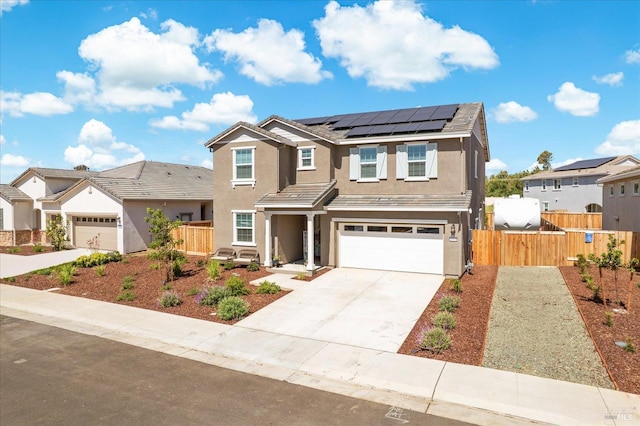 1532 Base Ct, Dixon, CA 95620 - traditional-style house featuring fence, concrete driveway, a garage, stucco siding, and solar panels