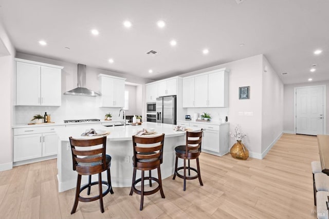 1532 Base Ct, Dixon, CA 95620 - kitchen featuring wall chimney range hood, stainless steel appliances, recessed lighting, and visible vents
