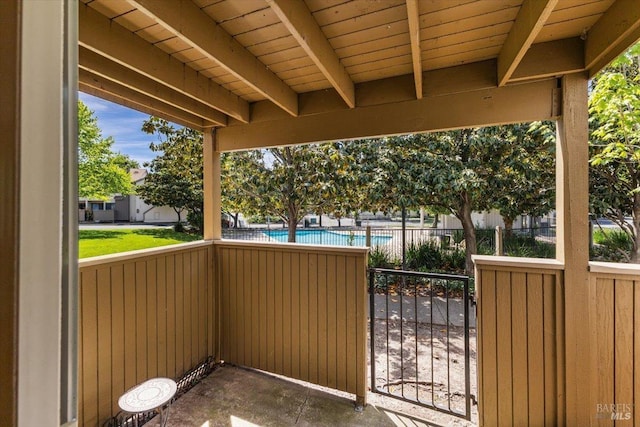 view of patio featuring fence and a fenced in pool